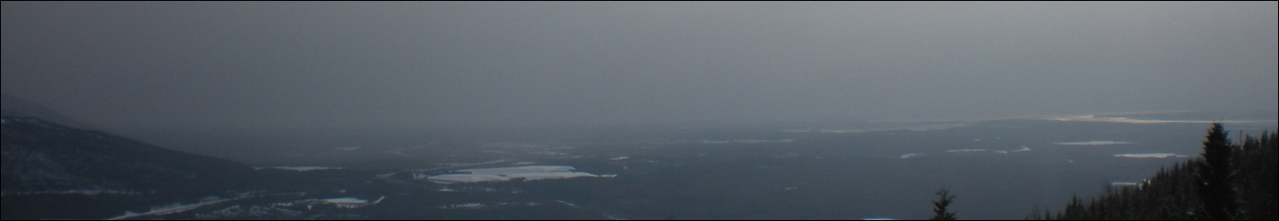 This shows the same view as above, but in the late afternoon with the plume already over Anchorage. Photo copyright 2009 by Leon Unruh.